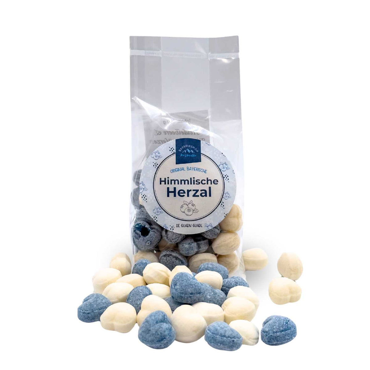 Himmlische Herzal - Guadl in durchsichtigem Beutel, blaue und weiße herzförmige Bonbons ausgebreitet.