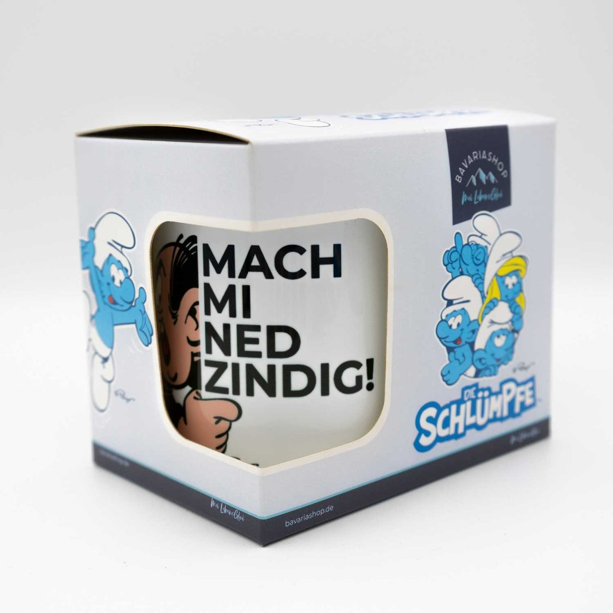 ®Die Schlümpfe Emailletasse "Mach mi ned zindig" in Geschenkbox, mit Schimpfi-Motiv und Schriftzug.