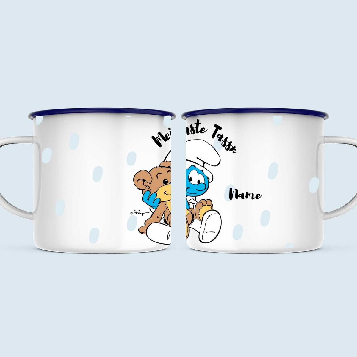 Weiße ®Die Schlümpfe Emailletasse Mei erste Tassn personalisiert mit Babyschlumpf und Teddybär Muster.