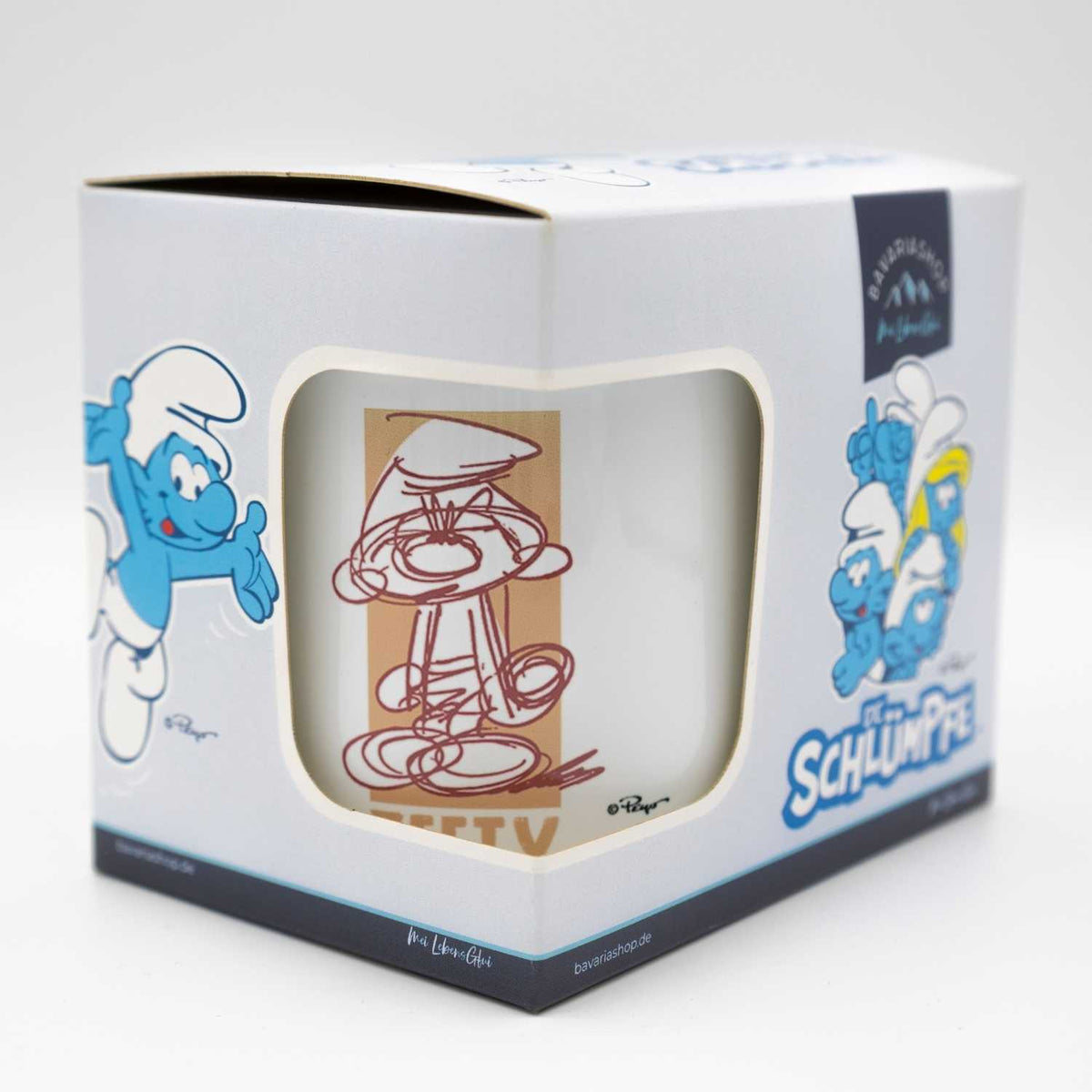 Die Schlümpfe Tasse Zefix in weißer Geschenkverpackung mit Sichtfenster und Schlumpf-Design.
