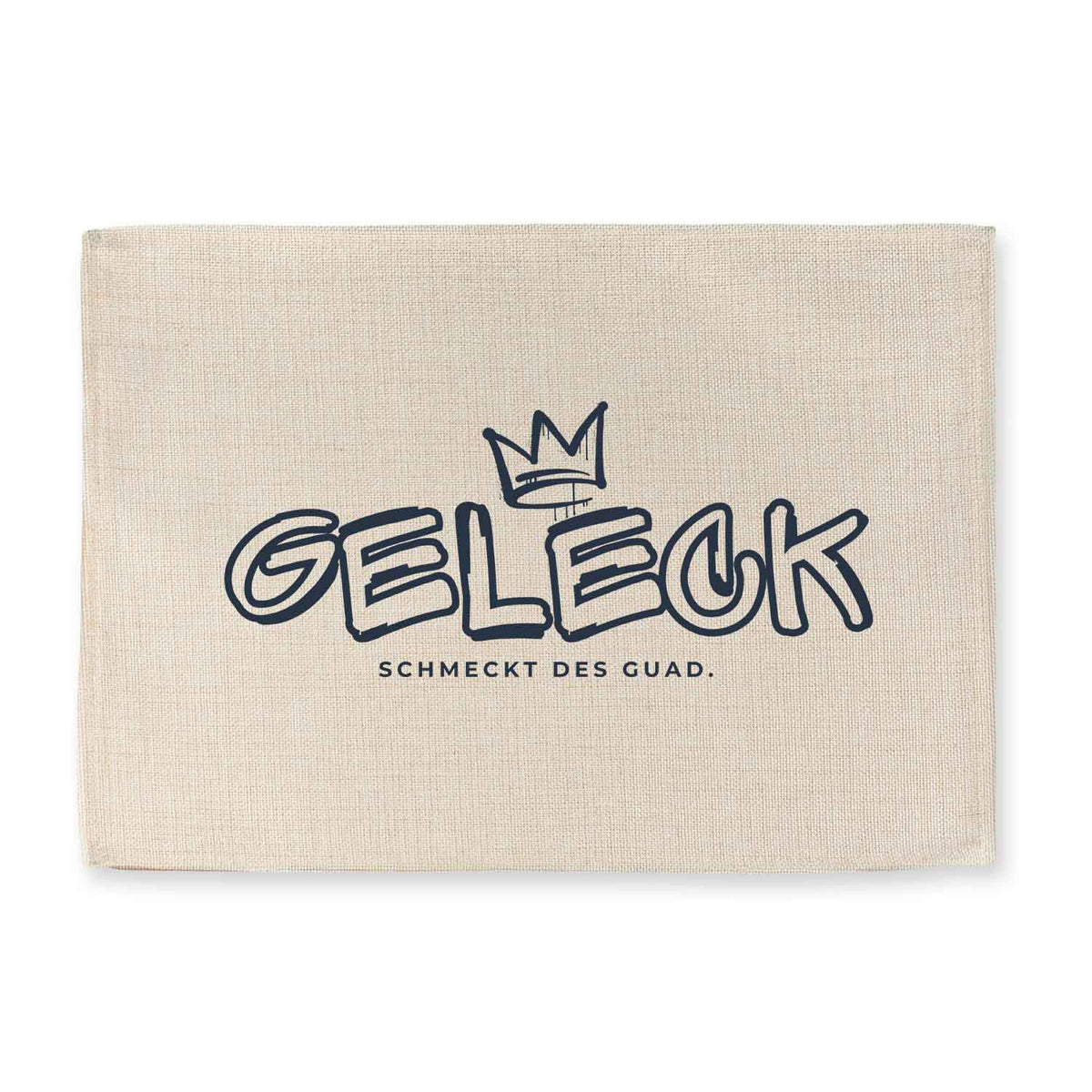 Tischset Geleck aus Leinenstoff mit Krone und Schriftzug Schmeckt des Guad, grau-beige, für Tischdekoration.