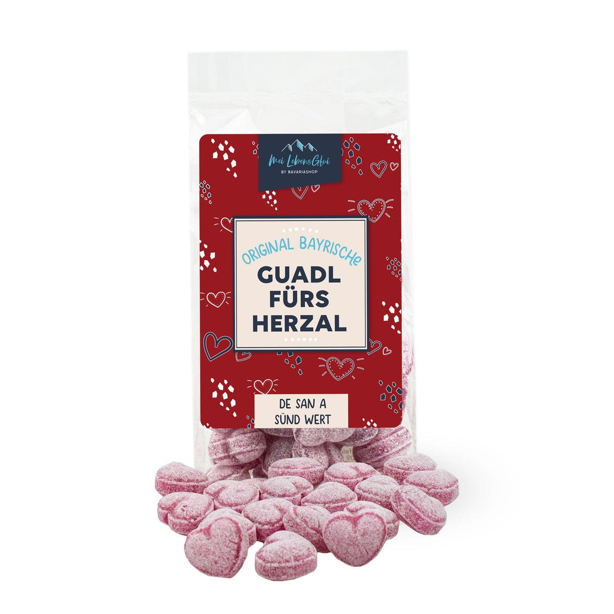 Geschenkbox "Ostern für de Großn" mit bayerischen Bonbons in Herzform in Klarsichttüte auf hellem Hintergrund.