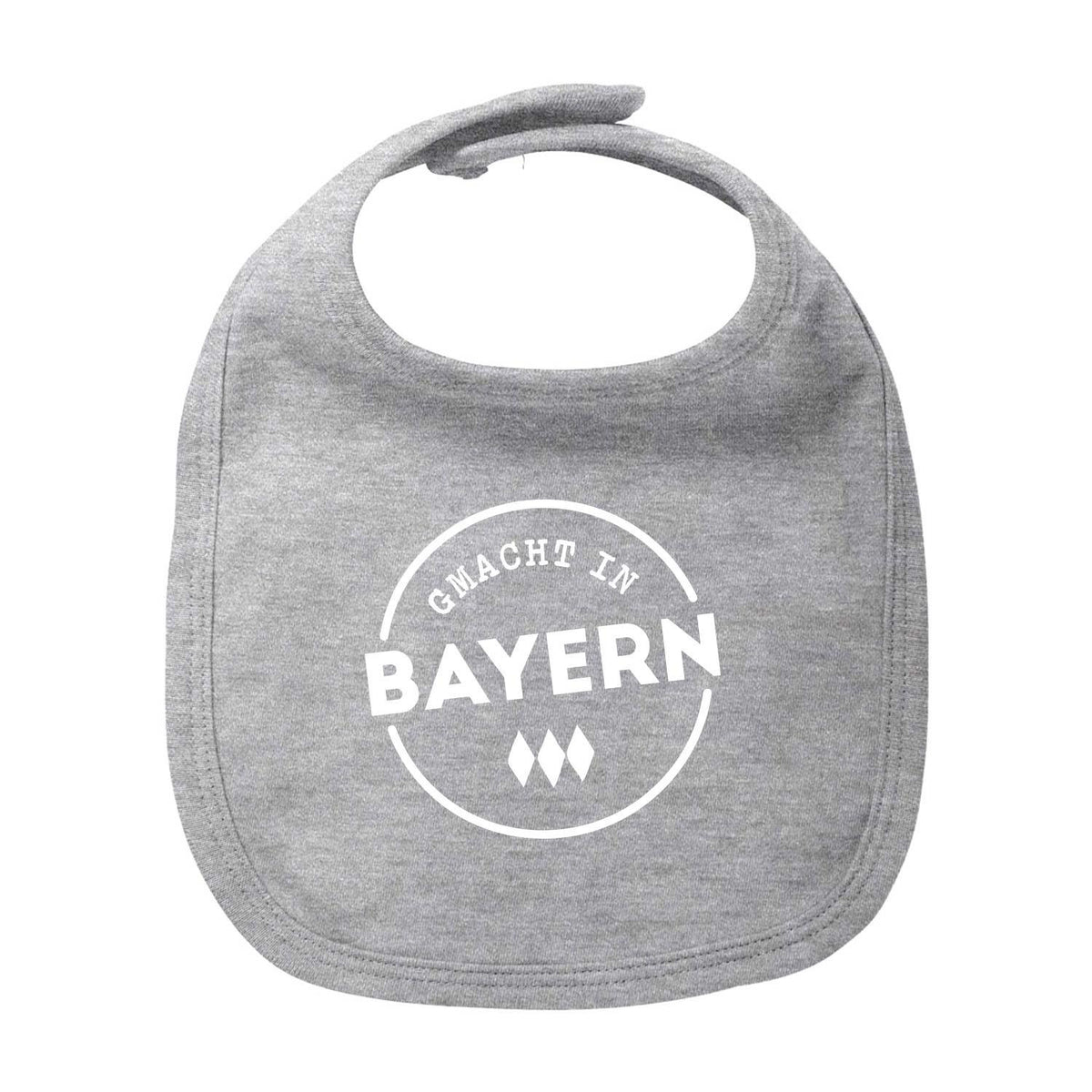 Graues Lätzchen Gmacht in Bayern für Babys mit weißem Logo und bayerischem Rautenmuster.