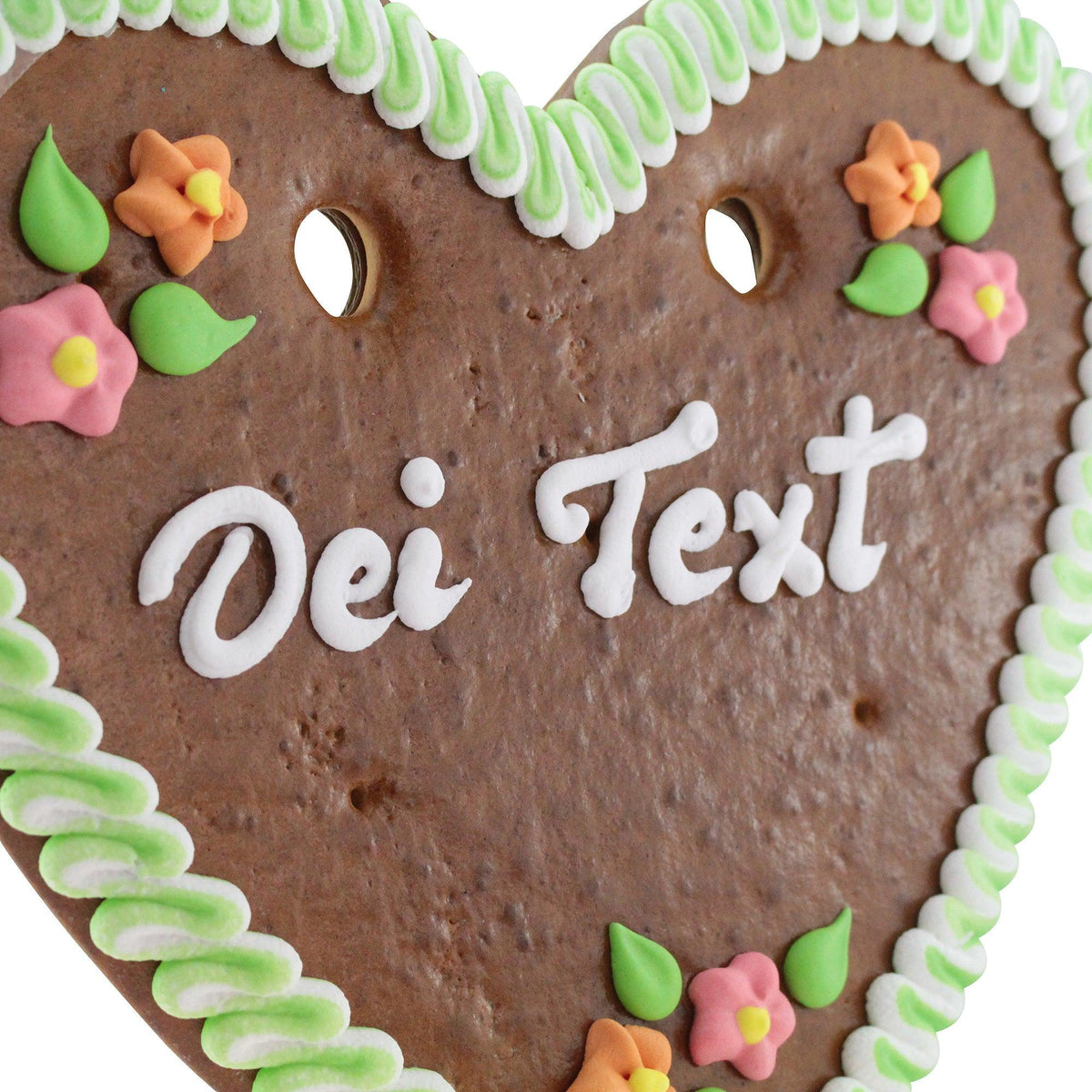 Lebkuchenherz mit individuell gestaltbarem Schriftzug "Dei Text", bunten Zuckerblumen und verzierter grüner Randverzierung.