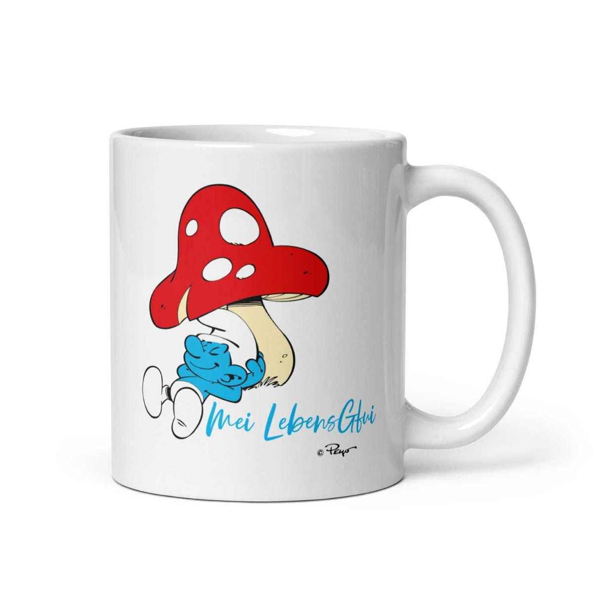 Weiße ®Die Schlümpfe Tasse "Do legst di nieda" mit Schlumpf unter einem Fliegenpilz und blauem Schriftzug.