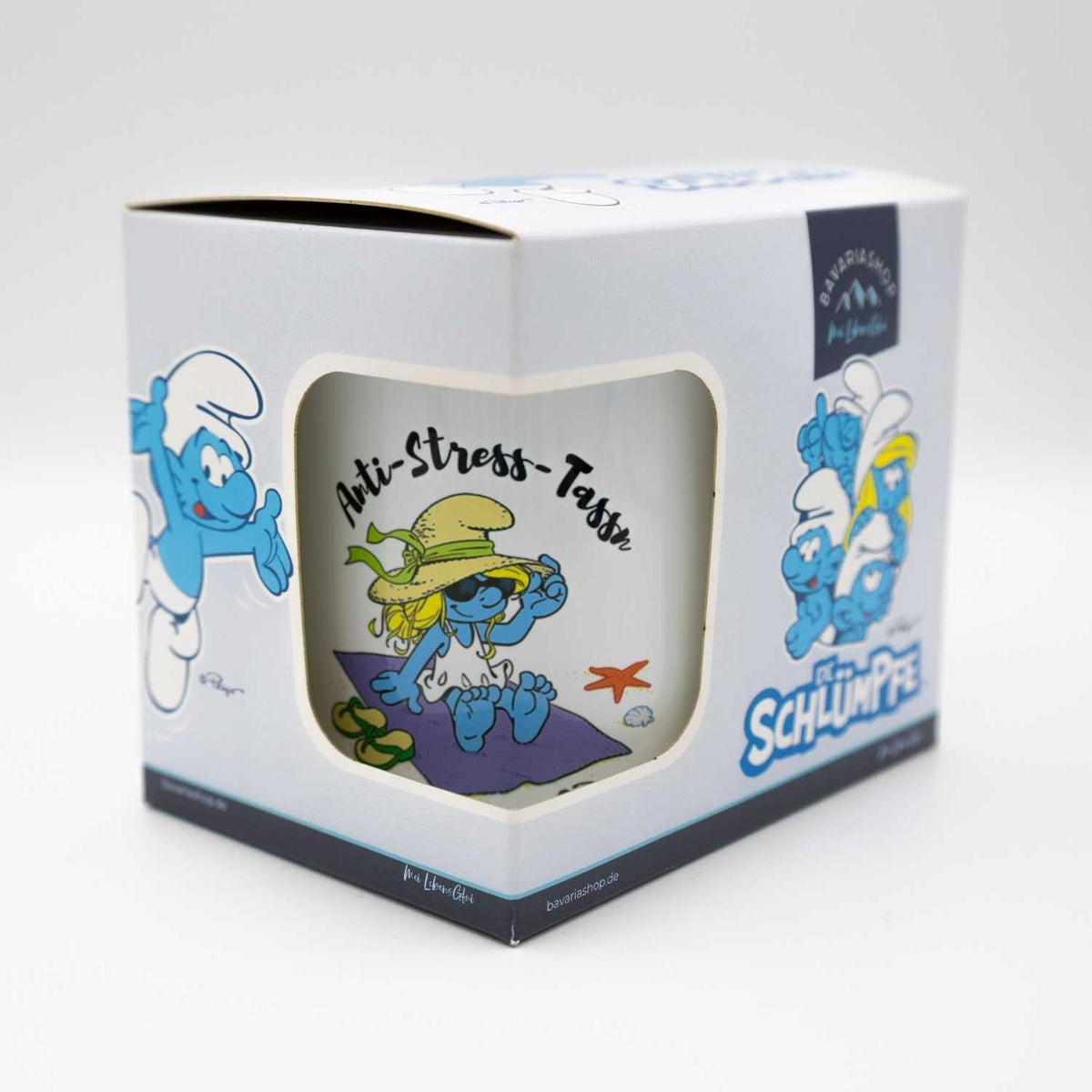 Emailletasse "Anti Stress Damen" mit Schlumpfine am Strand, verpackt in Kartonbox mit Schlumpfmotiven.